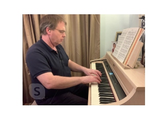 Image of Chris playing his digital piano in the online piano lesson